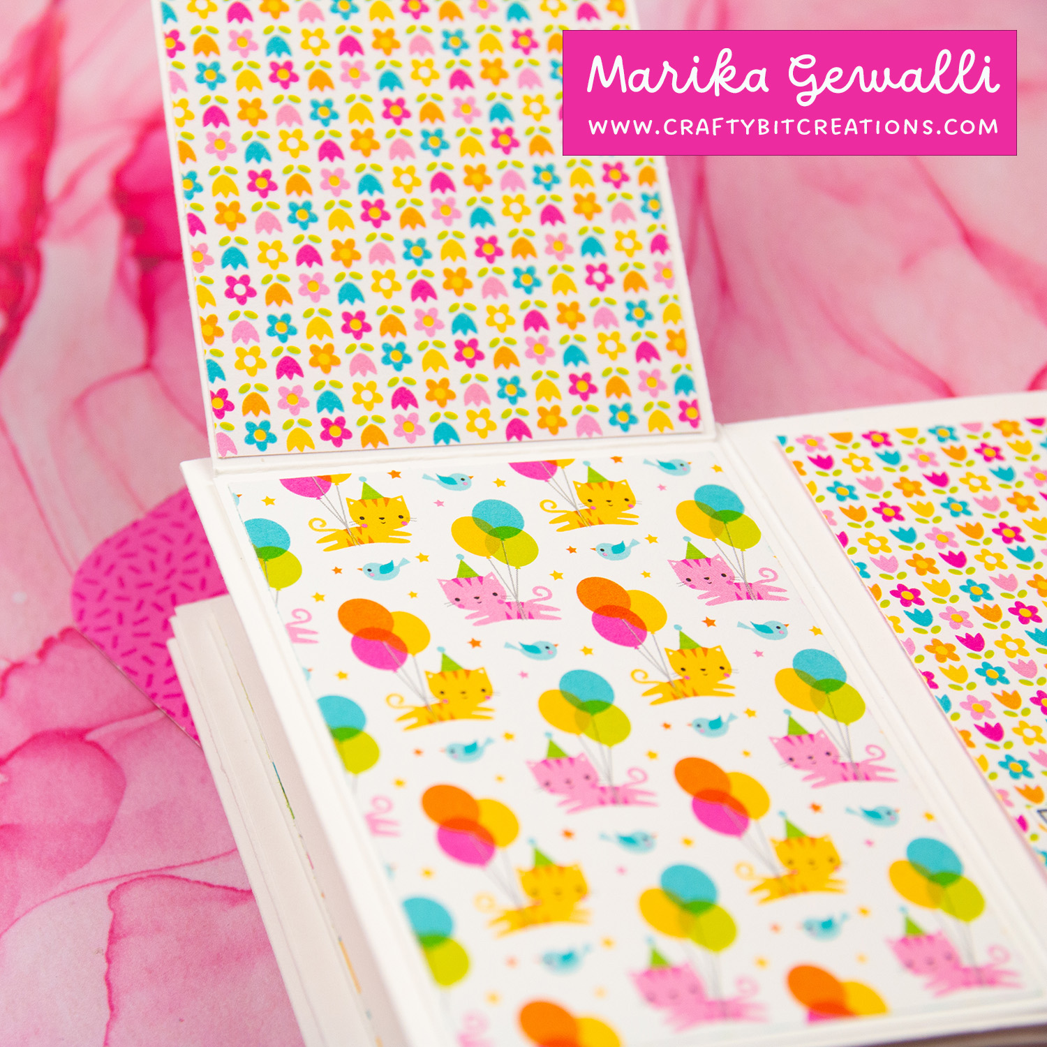 Close up of 4th spread of accordion album decorated with colorful pattern paper