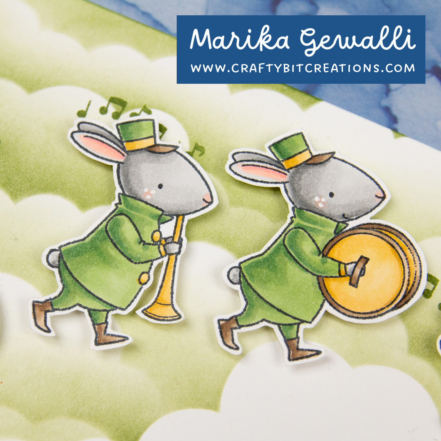 Closeup on copic colored stamp of two bunnies in band clothes holding a flute and zymbals