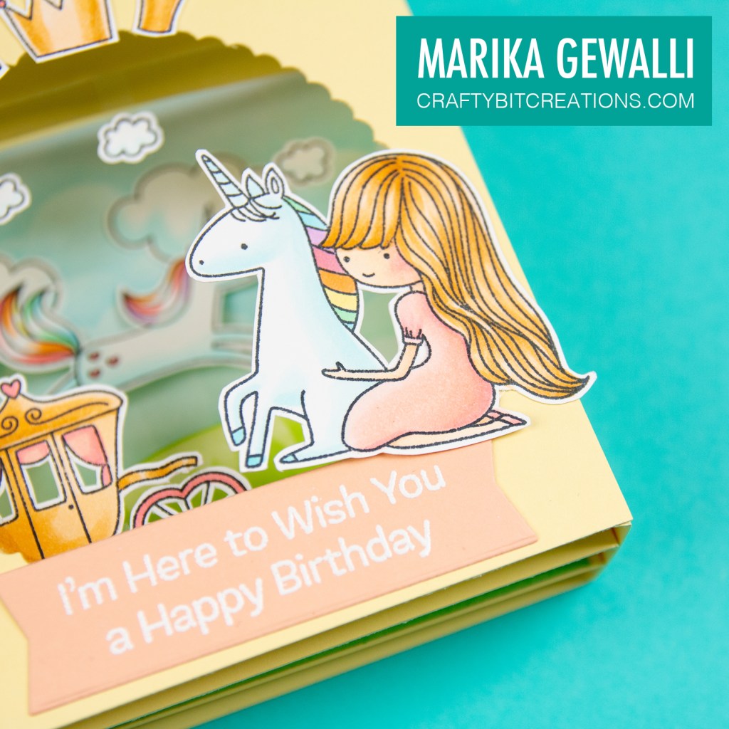 Close up of the lower right corner of the shadow box depicting the sitting princess who hugs a sitting unicorn.