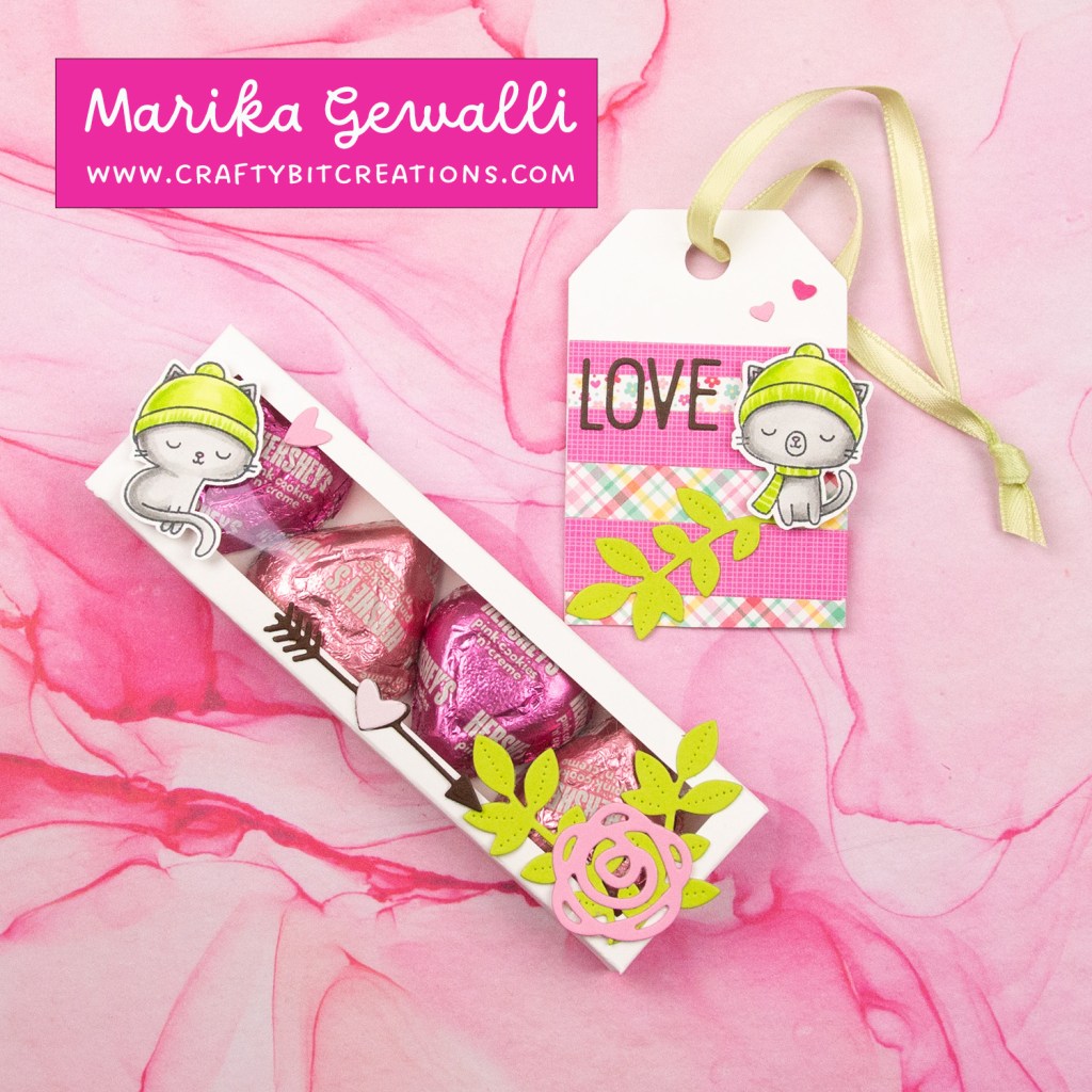 white decorated box with 4 hershey's hearts inside and a coordinating tag