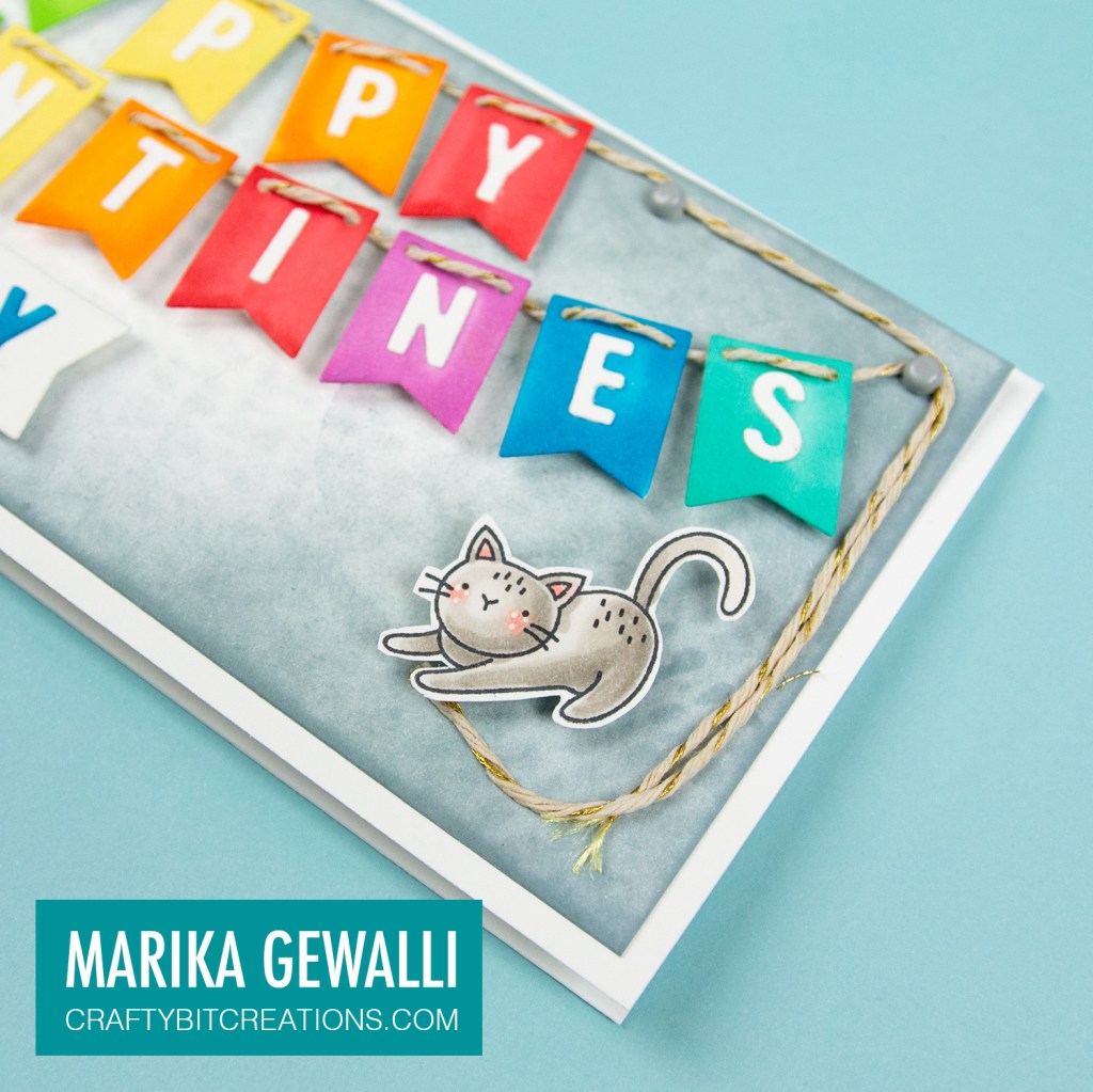 Close up of right side of Slimeline card showing a colored cartoon cat and the letters PPYTINES on rainbow banner flags