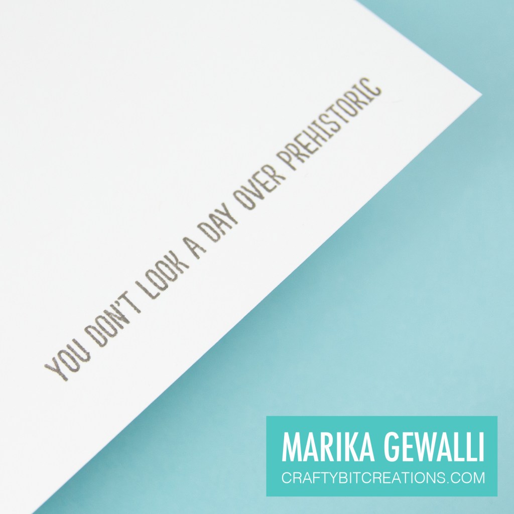 Close up of inside if card saying you don't look a day over prehistoric