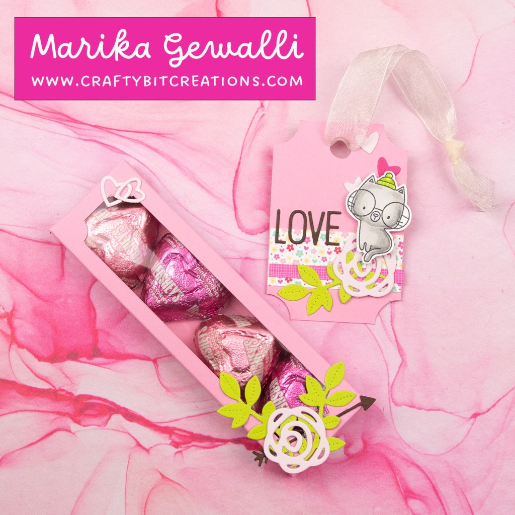 mid pink decorated box with 4 hershey's hearts inside and a coordinating tag