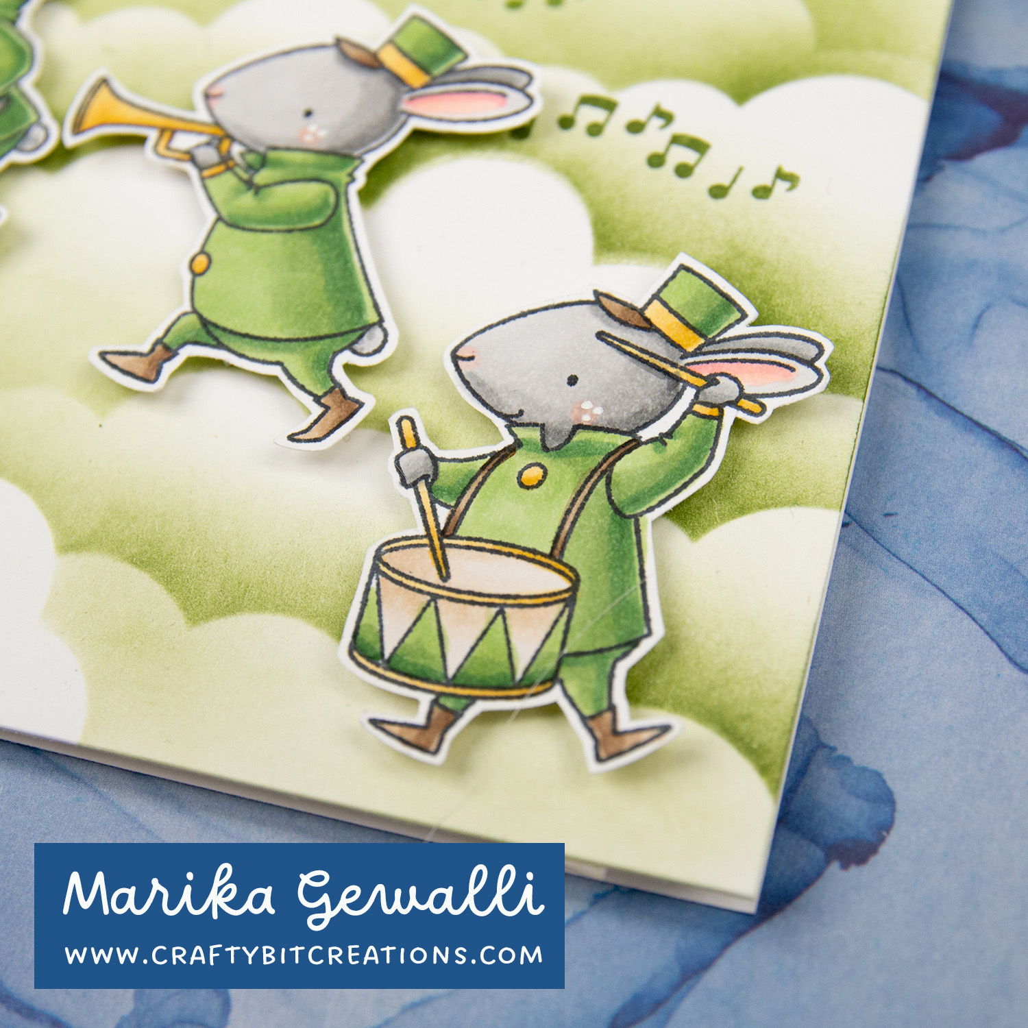 Closeup on copic colored stamp of a bunny in band clothes and a drum