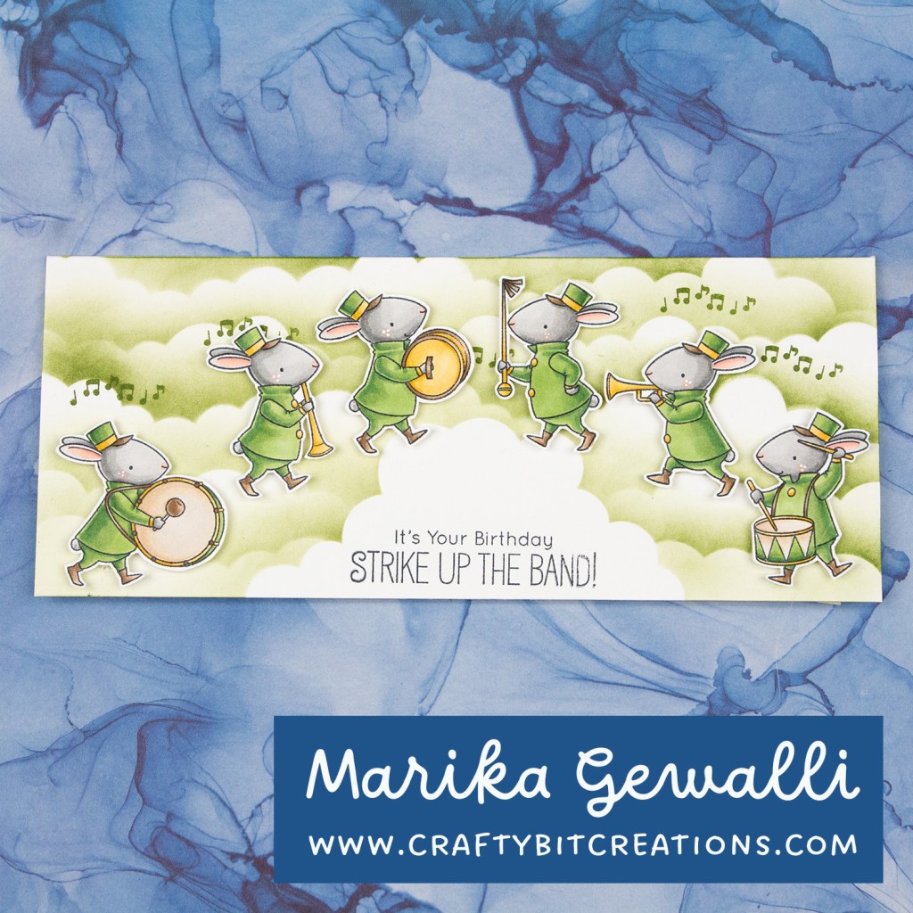 Full card showing six bunnies in band clothes with instruments walking among the clouds on a slimline card. With the sentiment it's your birthday strike up the band