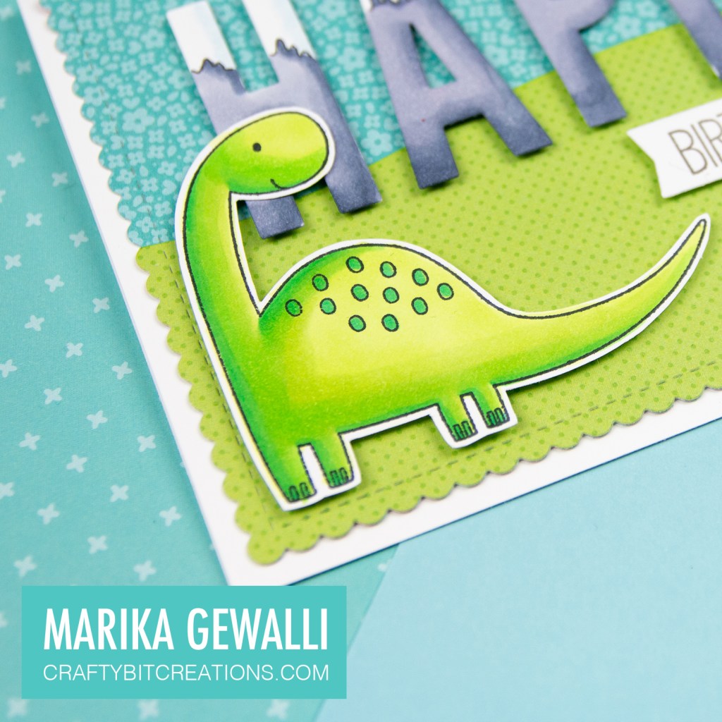 Close up of prehistoric Birthday Card showing a stamped dinosaur