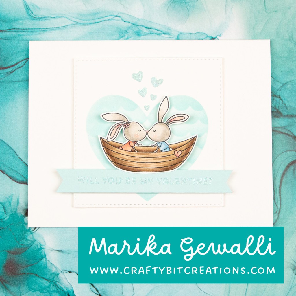 closeup blue valentines card, two bunnies in a boat with a heart as backdrop