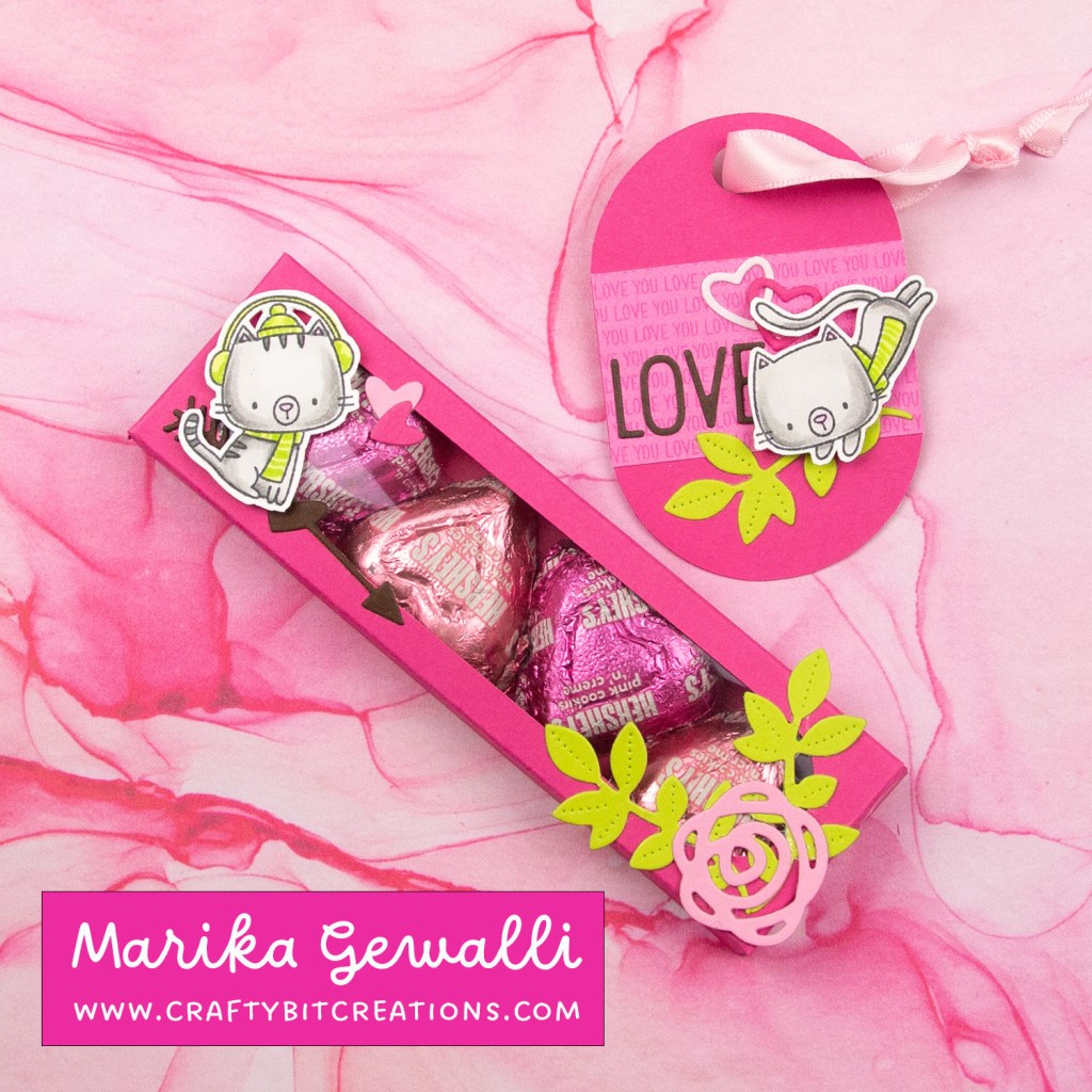 dark pink decorated box with 4 hershey's hearts inside and a coordinating tag