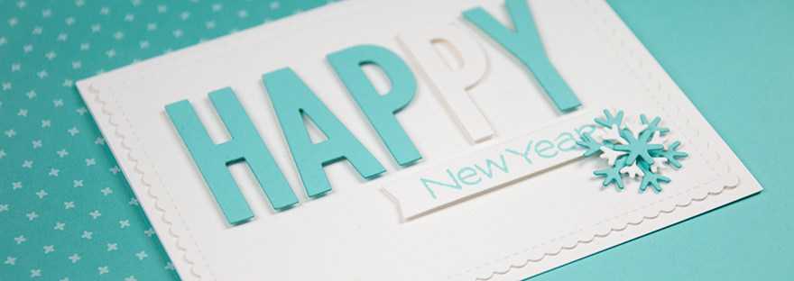 Closeup of Happy New Year card with alphabet dies