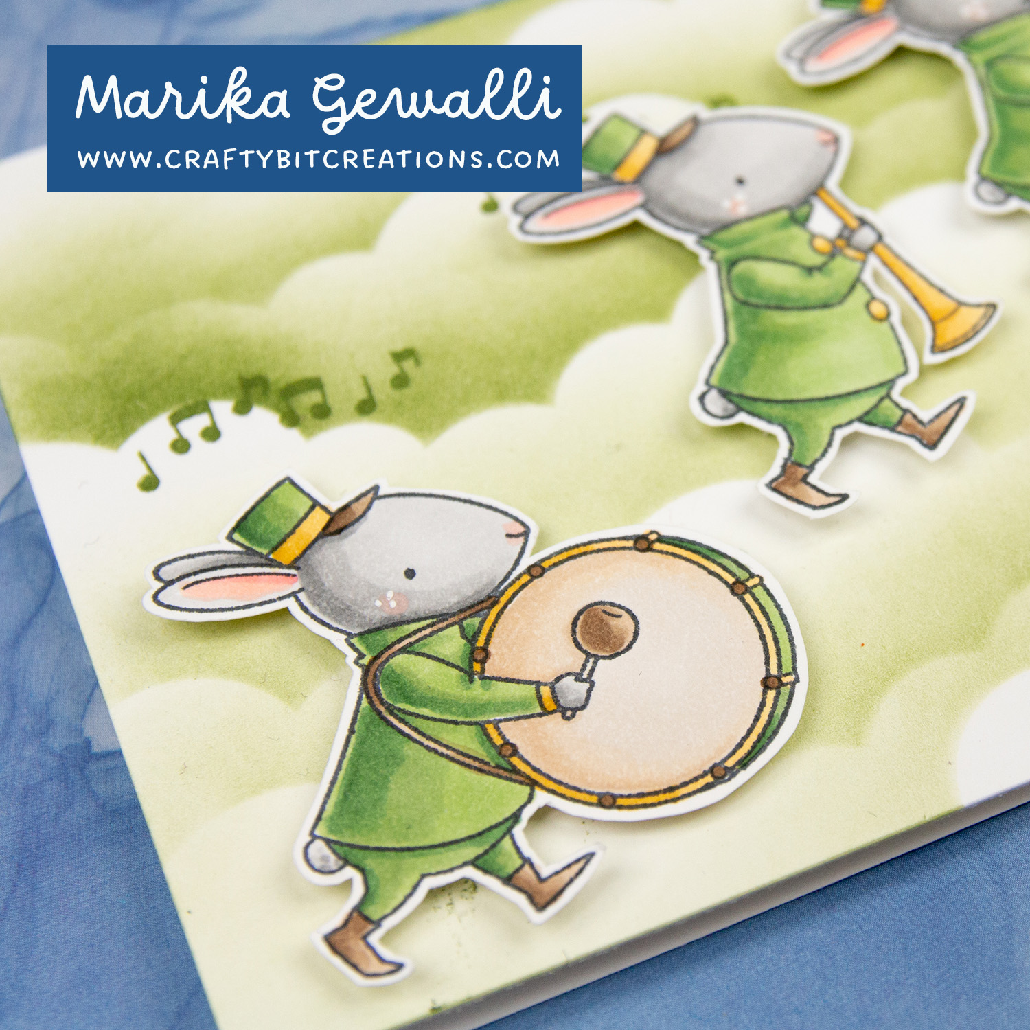 Closeup on copic colored stamp of a bunny in a band clothes and a drum