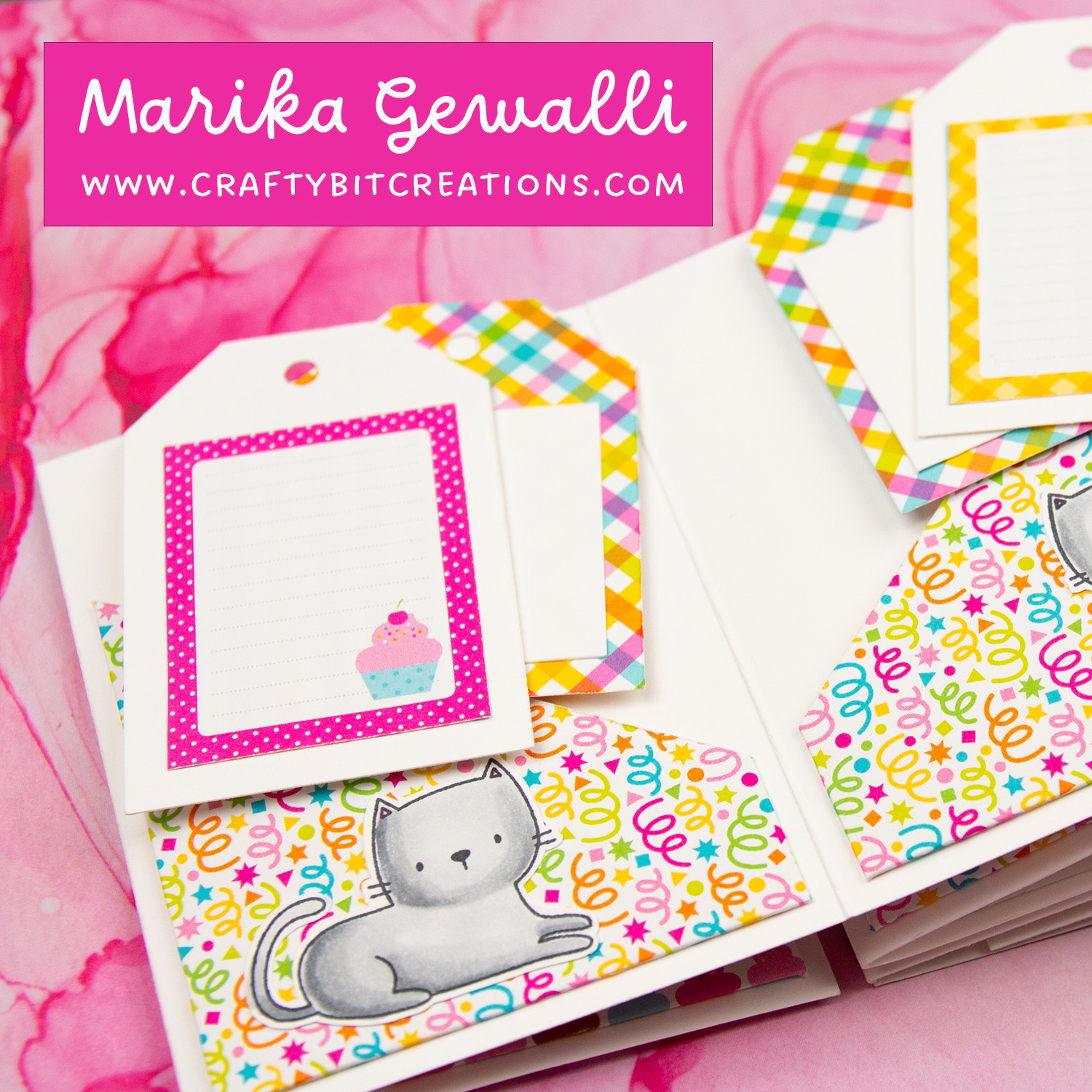 Close up of seventh spread of accordion album decorated with colorful pattern paper and a stamped cat