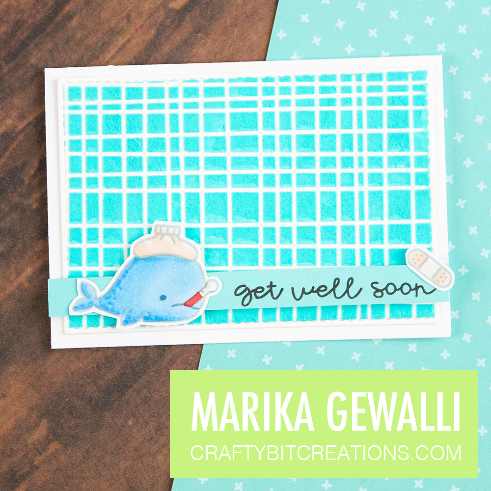 Stenciled embossing paste tinted with alcohol ink.