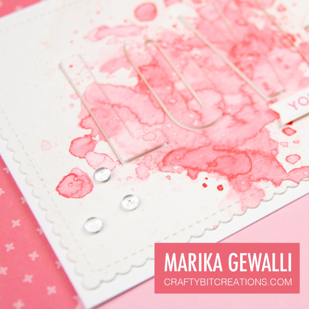 Closup of bubble sequins on splash love you card