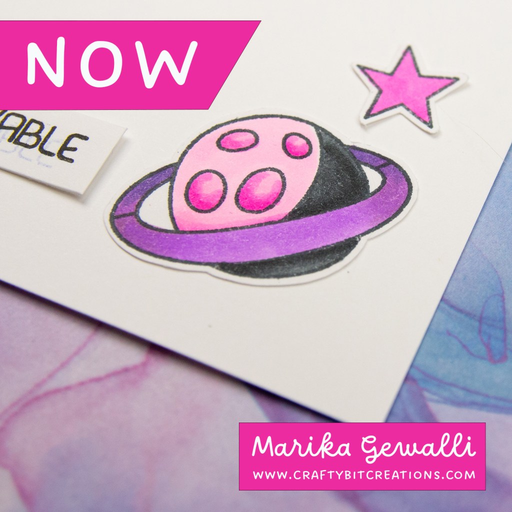 close up of planet colored with copics in pinks, purple and black