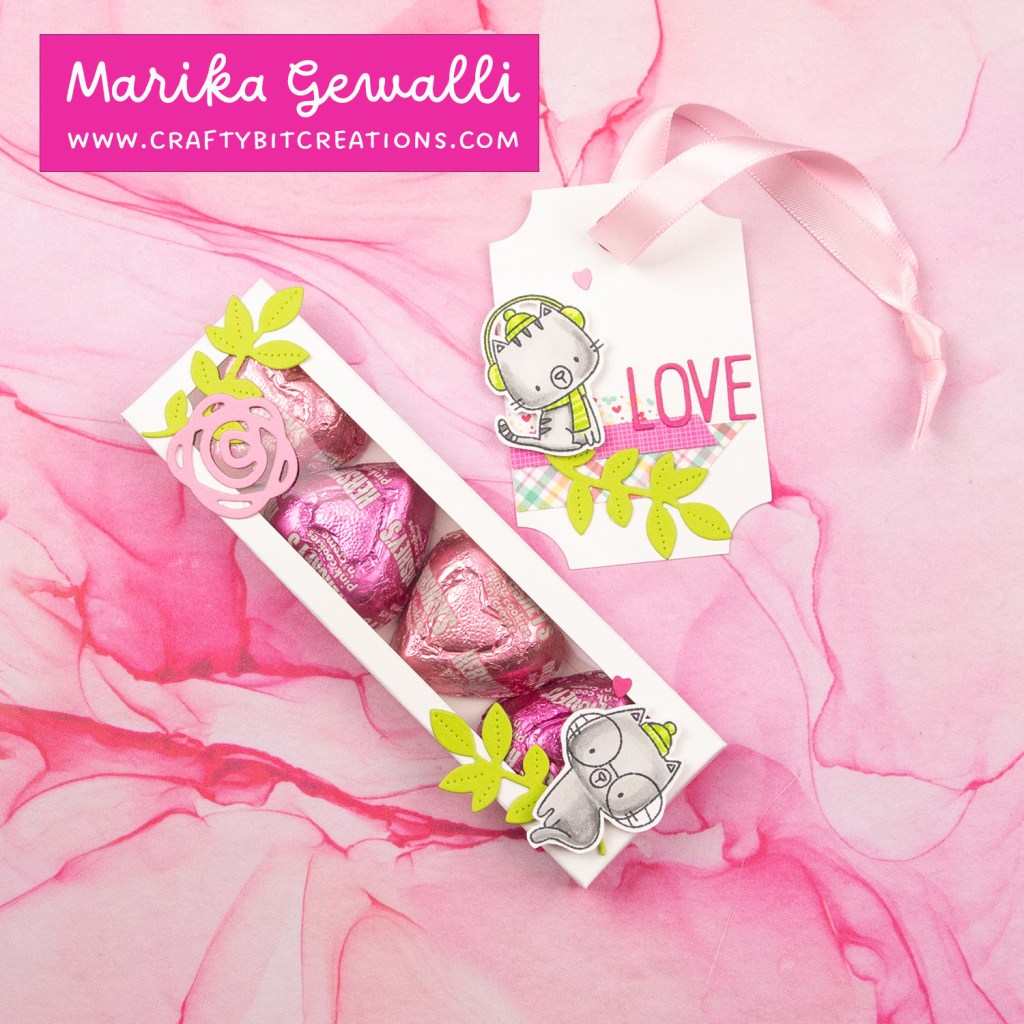 white decorated box with 4 hershey's hearts inside and a coordinating tag